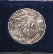 One Dollar "Liberty" (USA, 1987), 999/1000 Silber, Dm. ca. 4 cm, im orig. Etui.Stempelglanz.- - -