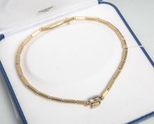 Designer-Halskette 585 GG, Juweliereinzelanfertigung, schmale Goldröhren, abgesetzt m.runden