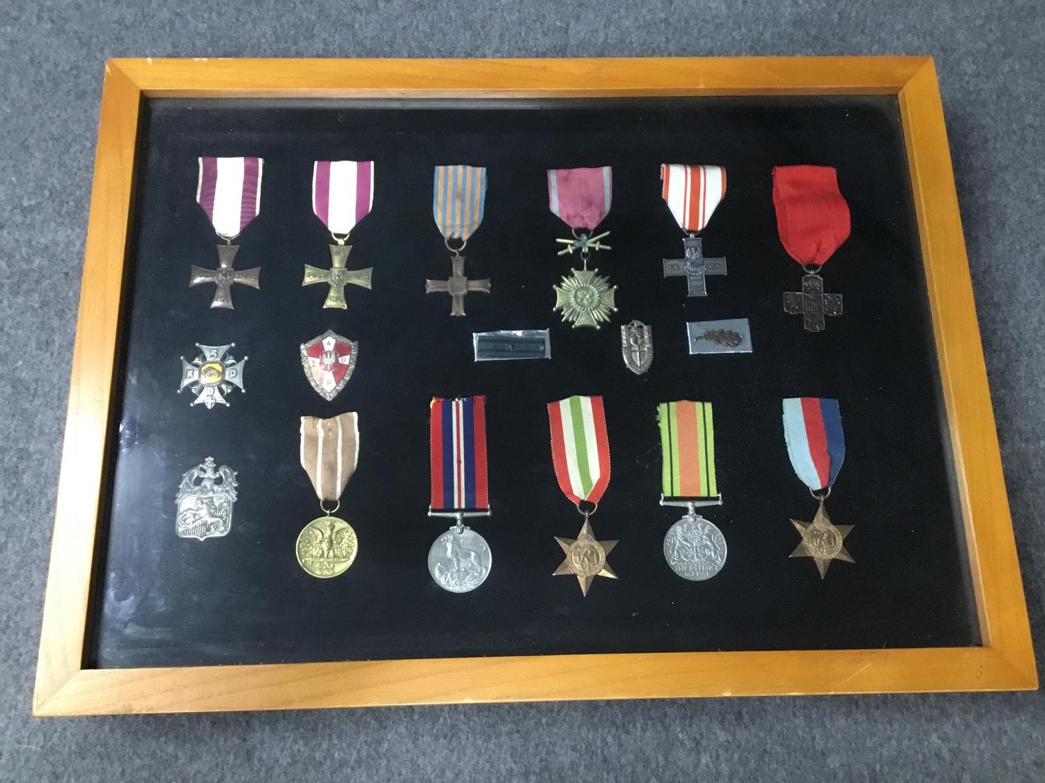 A framed collection of Polish and British WWII medals.