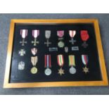 A framed collection of Polish and British WWII medals.