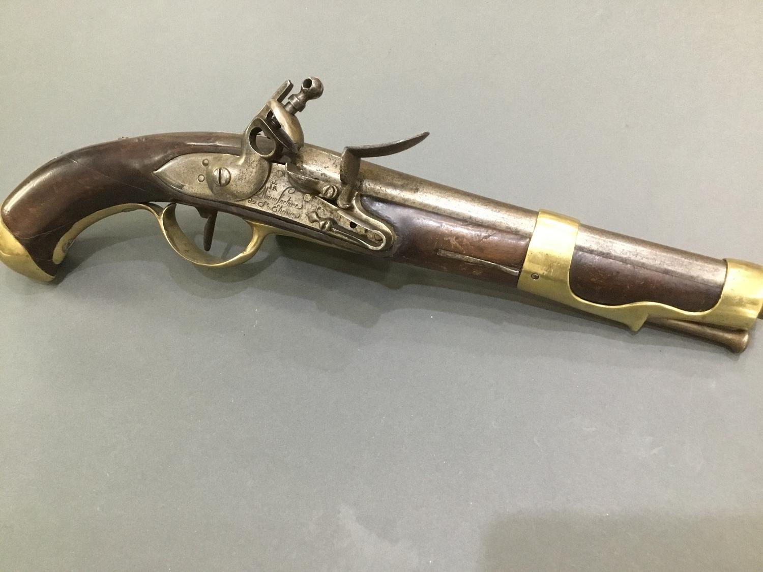 A late 18th Century French flintlock pistol engraved 'Manufacture do St Etienne'