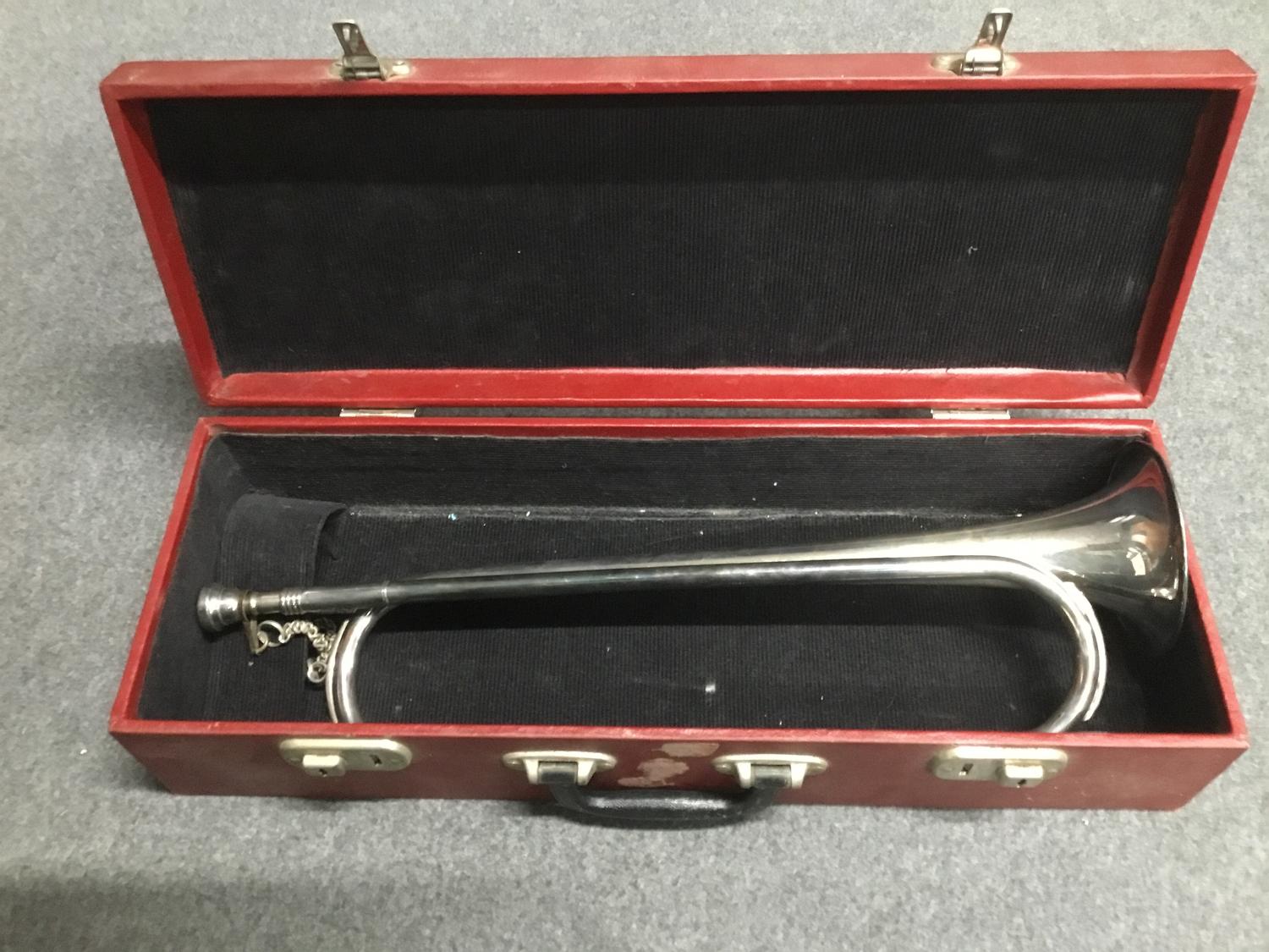 A silver plated military bugle in fitted case, unmarked