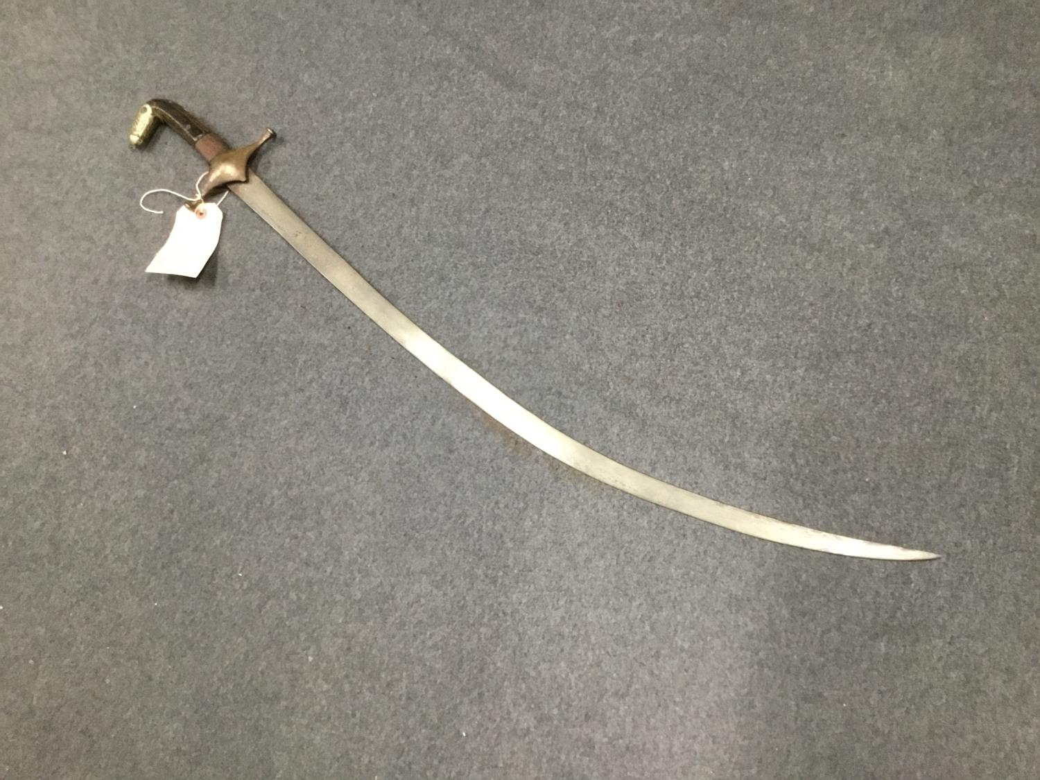 A 17th Century Polish Sabre Karabela with Polish Eagle circular mark to one side of the blade.