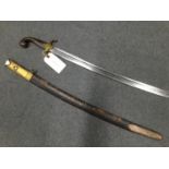 A Turkish Kilij engraved with star and crescent motif, leather scabbard