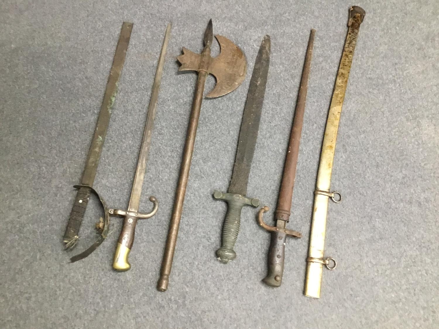 Five various 19th Century metal scabbards and an unmounted sword blade