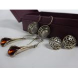 3 pairs of silver earrings ( one pair with clear stone, one pair with amber coloured stone)