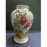 Moorcroft Baluster Vase with lily & tulip design, on a cream ground