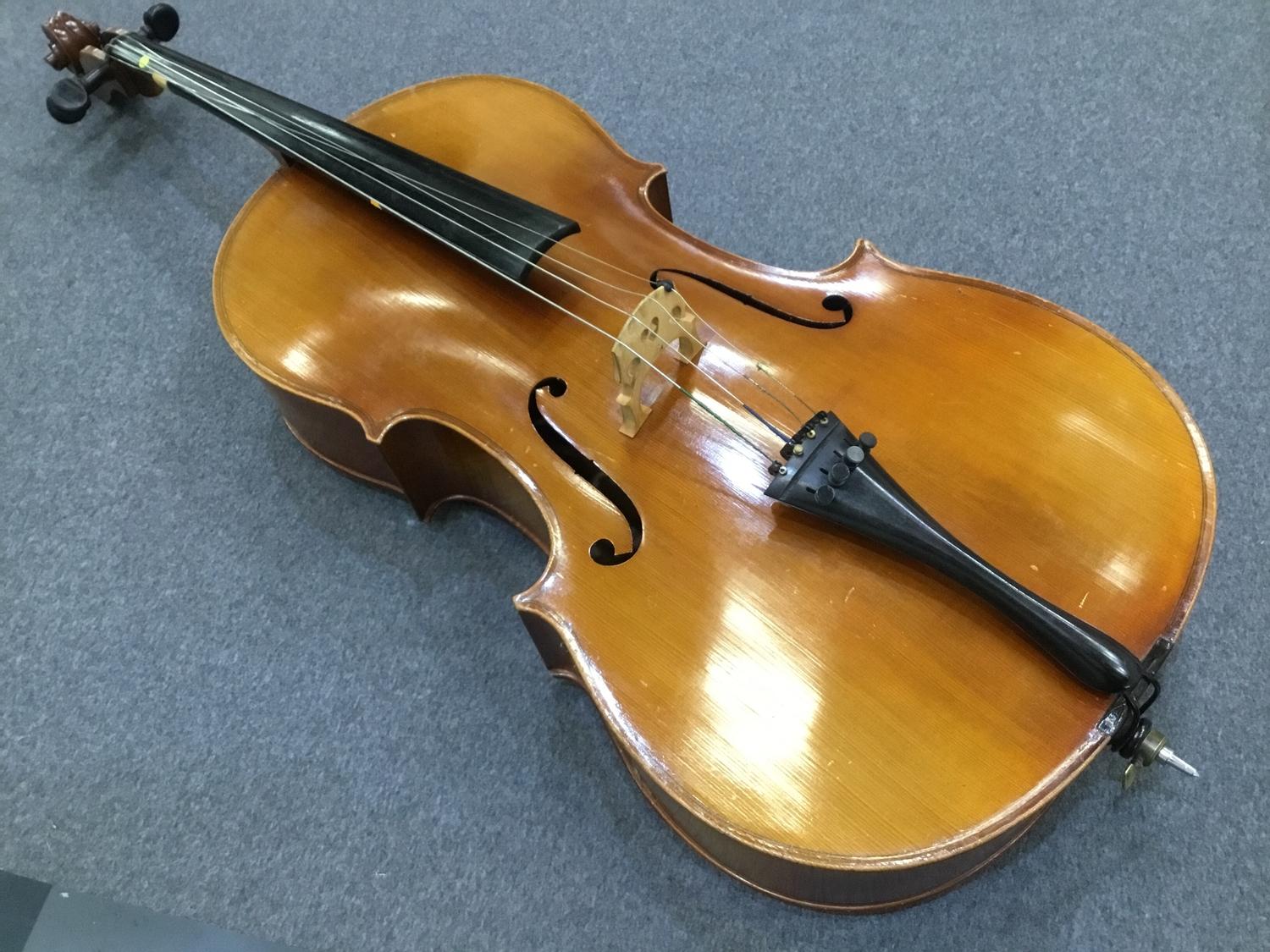 20th Century cello with two-piece flamed maple back and sides with deep carved spruce top