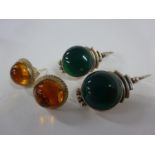 2 pairs of silver earrings (one green pair and other amber)