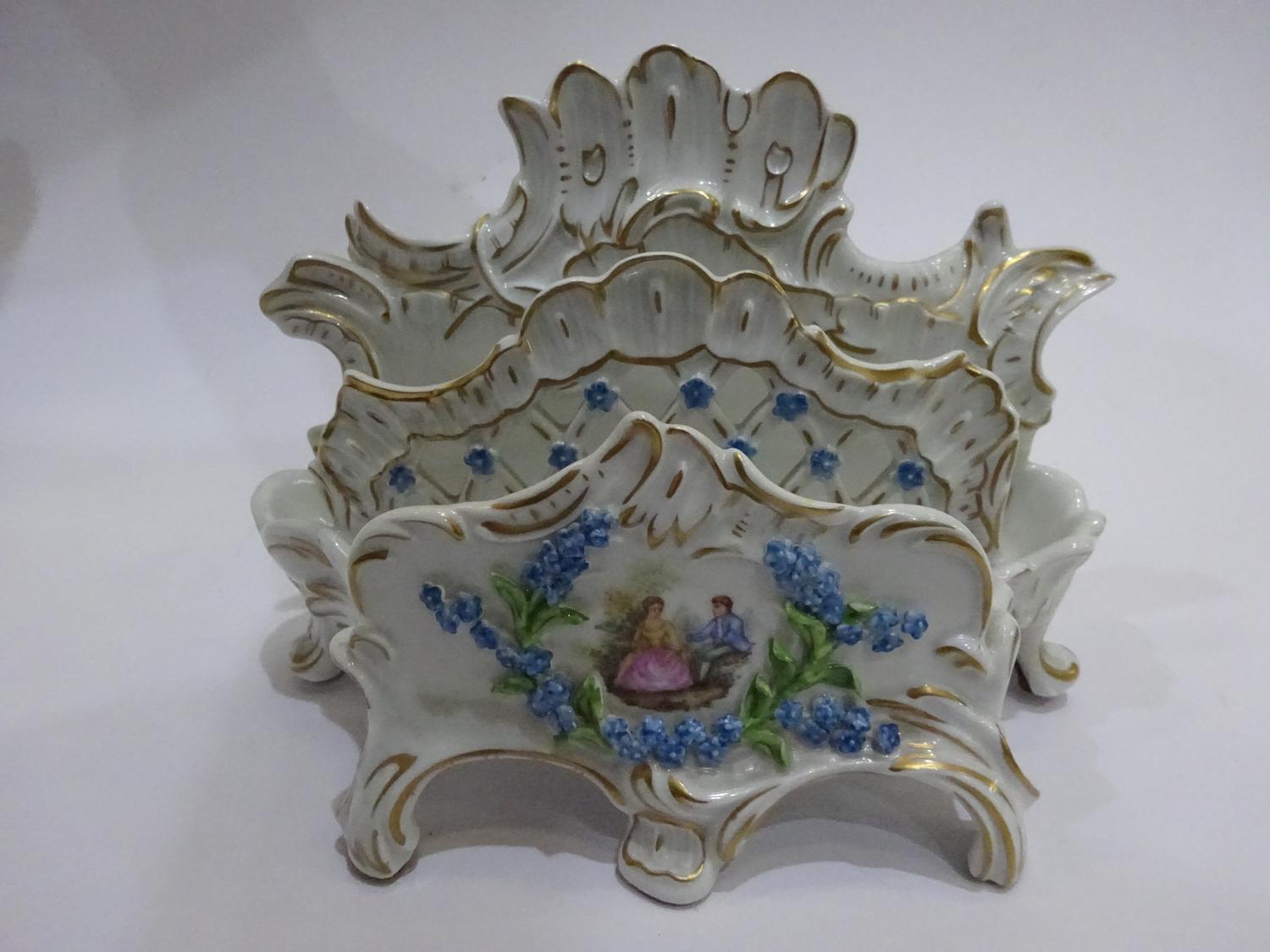 A DRESDEN WHITE GROUND PORCELAIN LETTER RACK