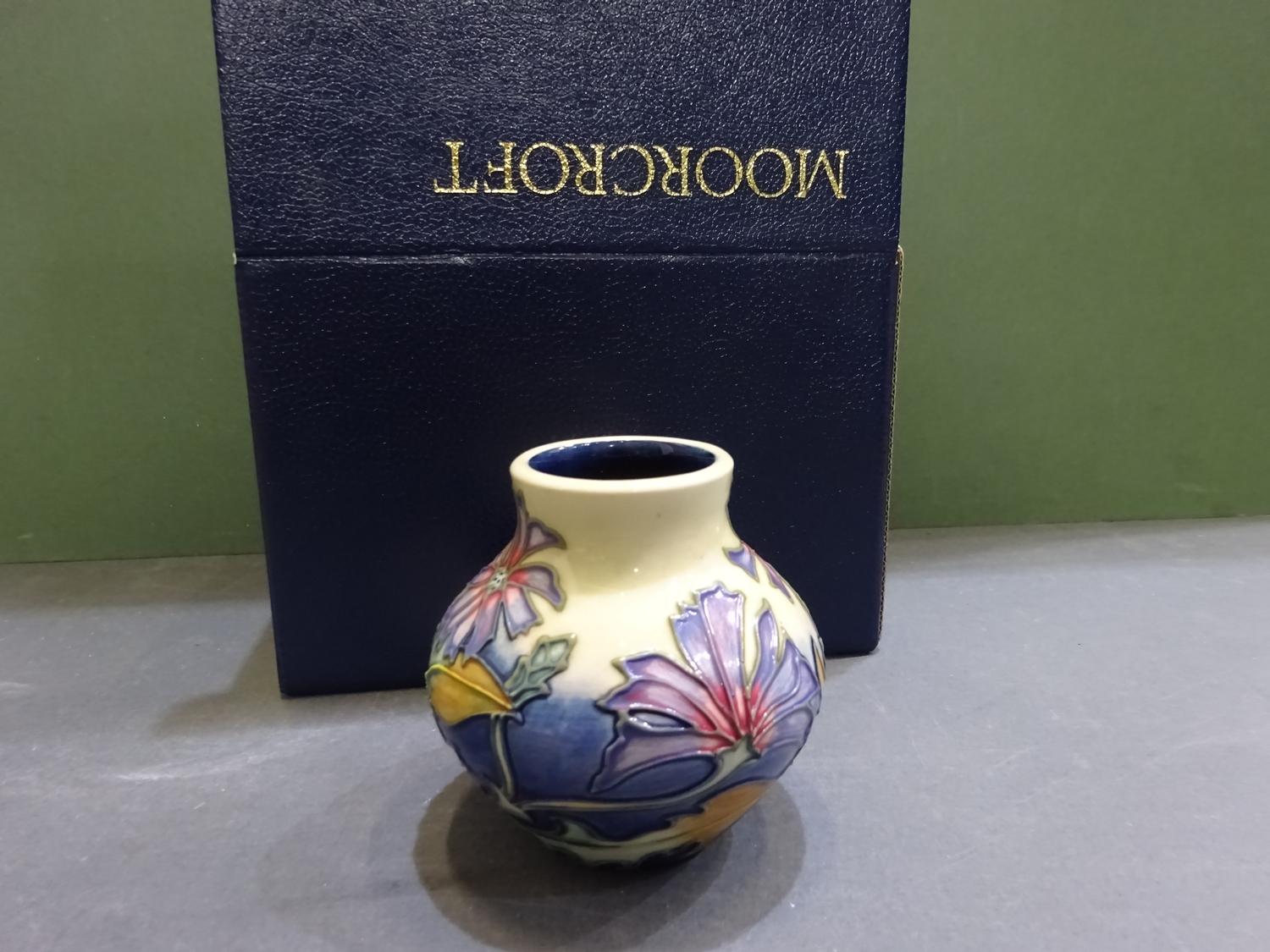 Moorcroft pottery vase, ovoid with small cylindrical neck. - comes with box