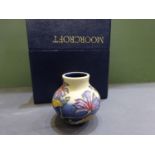 Moorcroft pottery vase, ovoid with small cylindrical neck. - comes with box