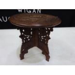 Dark wood carved side table