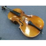20th Century cello with two-piece flamed maple back and sides with deep carved spruce top