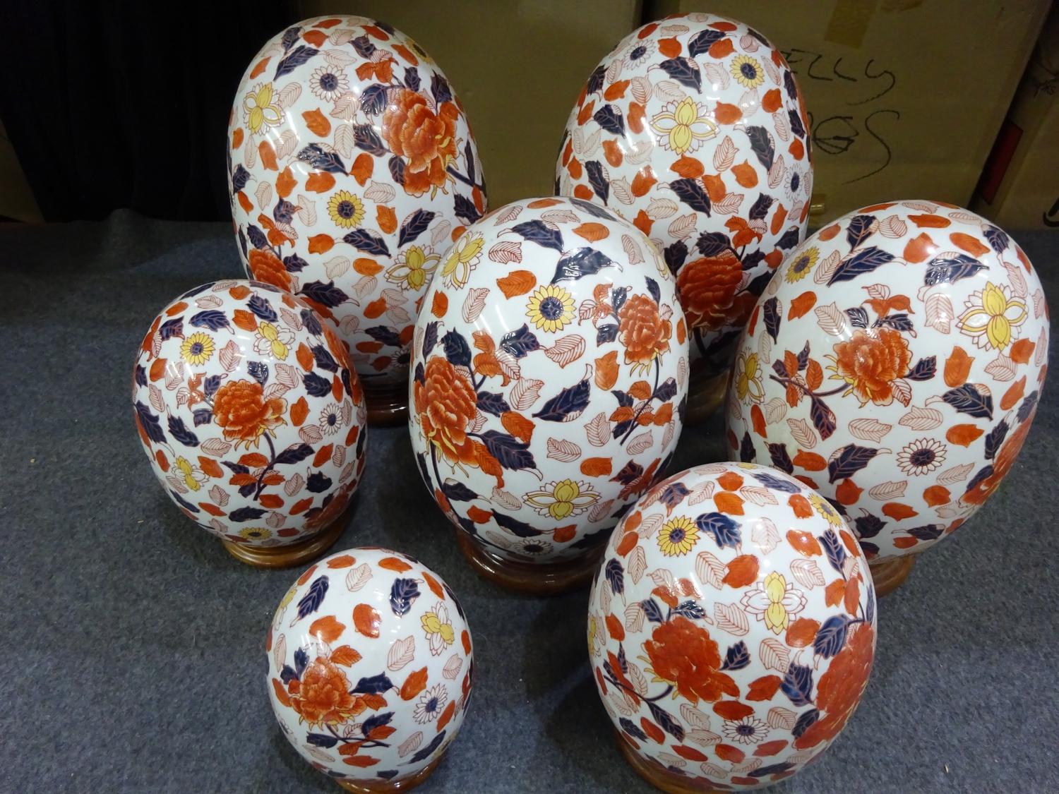 (F) Seven decorative ceramic eggs