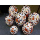 (F) Seven decorative ceramic eggs