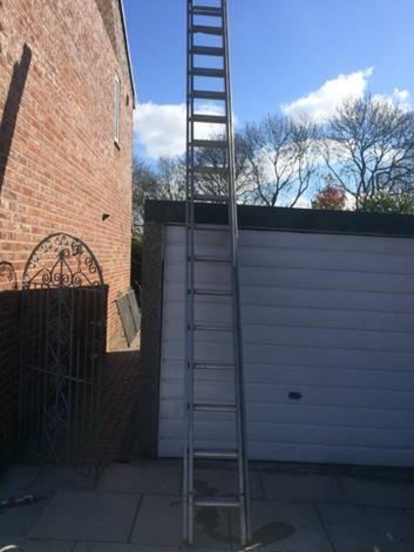 One 16 ft double aluminium extension ladder (with 32 ft span)