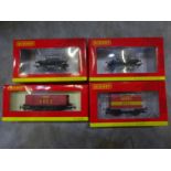 Four Hornby boxed carriages and trucks