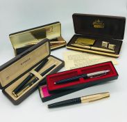 A selection of pens including a Parker 61.