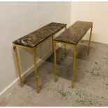 A Pair of Adam Williams design gold leaf frame Narwhal console tables on twisted brass legs with