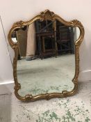Gilt mirror with scrolled detail