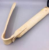 A white leather whip