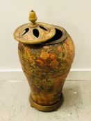 A Large decorative carved wooden lidded urn in a distressed style.