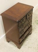 Small mahogany two over three bedside chest of drawers (H 64CM X W 49CM X D 33CM)