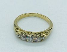 An Old cut five stone diamond ring in 18ct gold.