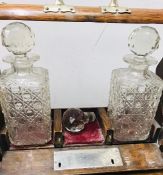 A 19th Century Tantalus, missing a decanter.