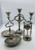 Three silver-plated items to include a bonbon dish, candlestick and a large sand timer.,