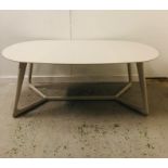 A Large pale grey oval dining table in a contemporary style 200cm W x 100cm D x 76cm H