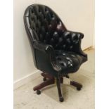 A Large button back leather club style captains chair
