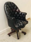 A Large button back leather club style captains chair