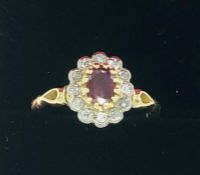 An 18ct yellow gold ruby and diamond cluster ring of 1.2ct's approx