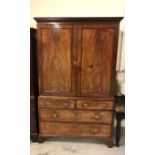 A Mahogany Linen Press with panelled doors two short and two long drawers to base 210cm x 121cm x