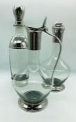 A set of three modern chrome and glass decanters by Eichholtz