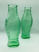 A pair of One Litre Fish Bottles in transparent green by Italian designer Paola Navone Forsera in