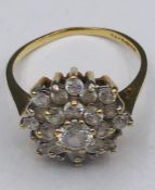 A Daisy style ring with CZ and 9ct yellow gold setting