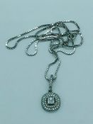 An 18ct white gold diamond set pendant necklace of 80 points approx. on a gold chain cased