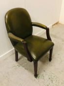 Green leather office arm chair with brass stud detailing