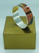 A Metropolitan Museum of Art Klimt Textile pattern bangle in original box.