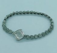 A silver and CZ bracelet with heart shaped links and clasp