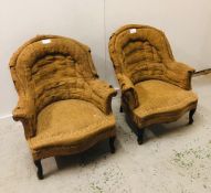 Pair of deconstructed wing back chairs in need of re-upholstery.