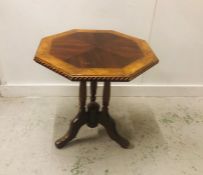 An Octagonal top occasional table with turned supports