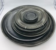 A large collection of pewter plates (15 in total)