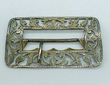 A silver buckle by CEW, hallmarked Birmingham.