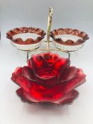 A double bonbon dish on stand and a red glass flower candle holder