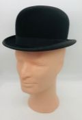 A Locke & Co Bowler hat (size unknown)