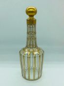 A small decorative decanter with gold pattern